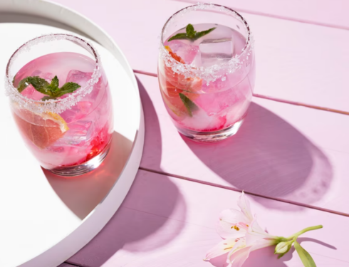 pink cocktails with mint on the pink table with flower