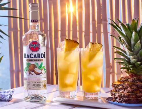 Bottle of Bacardi with two cocktails on the table